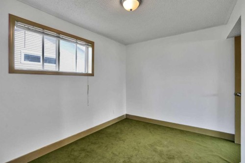 212 Pinetree Place Ne, Calgary, AB - Indoor Photo Showing Other Room