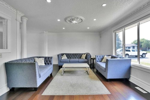 212 Pinetree Place Ne, Calgary, AB - Indoor Photo Showing Living Room