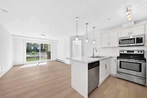 2105-450 Sage Valley Drive Nw, Calgary, AB - Indoor Photo Showing Kitchen With Stainless Steel Kitchen With Upgraded Kitchen