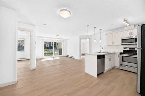 2105-450 Sage Valley Drive Nw, Calgary, AB - Indoor Photo Showing Kitchen With Stainless Steel Kitchen With Upgraded Kitchen