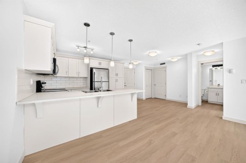 2105-450 Sage Valley Drive Nw, Calgary, AB - Indoor Photo Showing Kitchen With Upgraded Kitchen