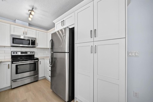 2105-450 Sage Valley Drive Nw, Calgary, AB - Indoor Photo Showing Kitchen With Stainless Steel Kitchen