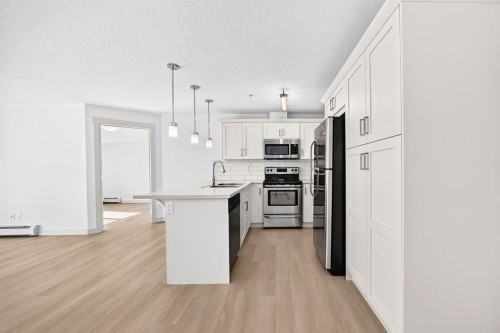 2105-450 Sage Valley Drive Nw, Calgary, AB - Indoor Photo Showing Kitchen With Upgraded Kitchen