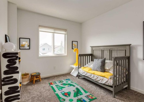 71 Seton Gardens Se, Calgary, AB - Indoor Photo Showing Bedroom