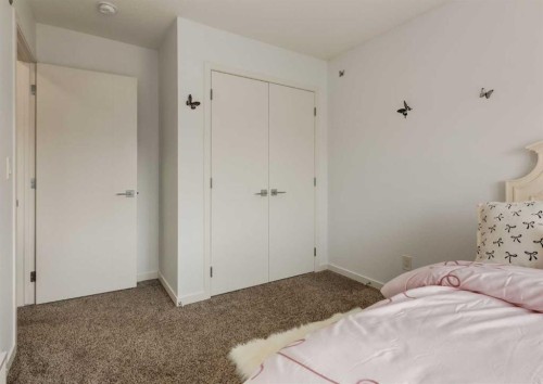71 Seton Gardens Se, Calgary, AB - Indoor Photo Showing Bedroom