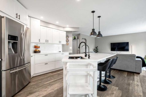 141 Somerset Circle Sw, Calgary, AB - Indoor Photo Showing Kitchen With Stainless Steel Kitchen With Upgraded Kitchen