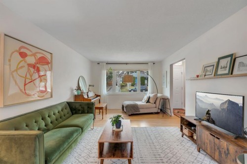 254 Hendon Drive Nw, Calgary, AB - Indoor Photo Showing Living Room With Fireplace