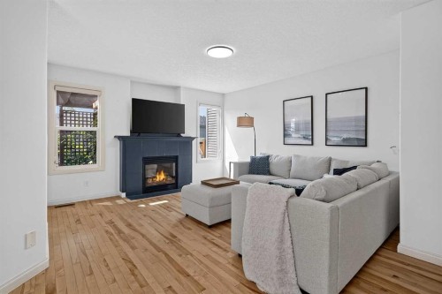 79 Autumn Green Se, Calgary, AB - Indoor Photo Showing Living Room With Fireplace