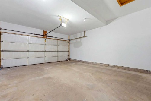 50 Douglasview Park Se, Calgary, AB - Indoor Photo Showing Garage