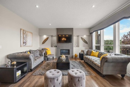 183 Aspen Acres Manor Sw, Calgary, AB - Indoor Photo Showing Living Room With Fireplace