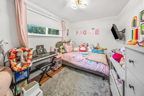 703 Millar Road Ne, Calgary, AB - Indoor Photo Showing Bedroom