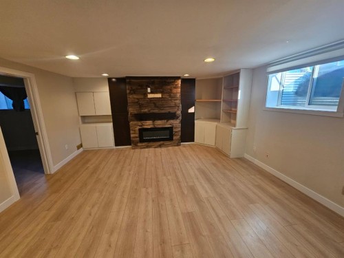 703 Millar Road Ne, Calgary, AB - Indoor With Fireplace