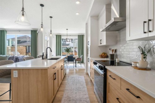 62 Southborough Crescent, Cochrane, AB - Indoor Photo Showing Kitchen With Upgraded Kitchen