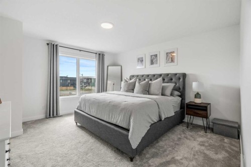 62 Southborough Crescent, Cochrane, AB - Indoor Photo Showing Bedroom