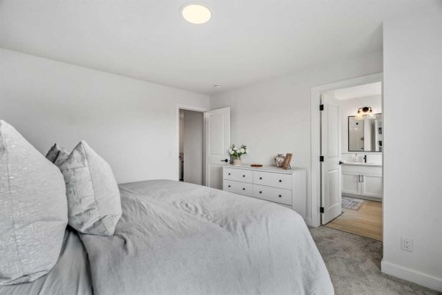 62 Southborough Crescent, Cochrane, AB - Indoor Photo Showing Bedroom