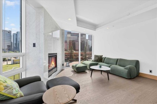 302-738 1 Avenue Sw, Calgary, AB - Indoor Photo Showing Living Room With Fireplace