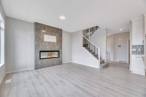 63 Setonvista Grove Se, Calgary, AB - Indoor Photo Showing Living Room With Fireplace
