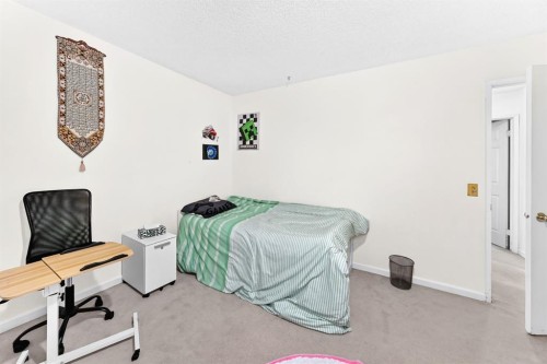 983 Rundlecairn Way Ne, Calgary, AB - Indoor Photo Showing Bedroom