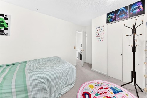 983 Rundlecairn Way Ne, Calgary, AB - Indoor Photo Showing Bedroom