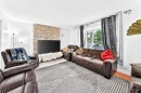 983 Rundlecairn Way Ne, Calgary, AB  - Indoor Photo Showing Living Room With Fireplace 