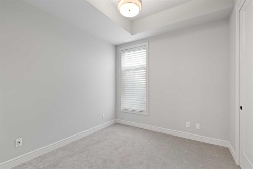 203-275 Lebel Crescent Nw, Calgary, AB - Indoor Photo Showing Other Room