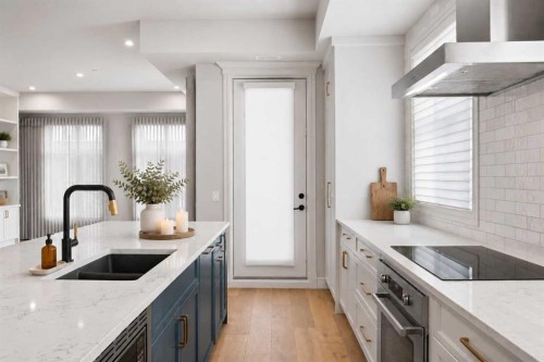203-275 Lebel Crescent Nw, Calgary, AB - Indoor Photo Showing Kitchen With Double Sink With Upgraded Kitchen