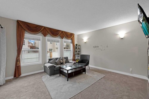 77 Saddleland Drive Ne, Calgary, AB - Indoor Photo Showing Living Room
