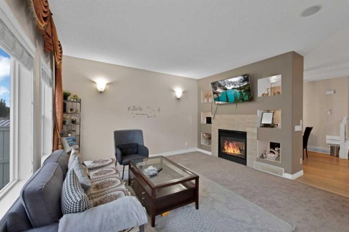 77 Saddleland Drive Ne, Calgary, AB - Indoor Photo Showing Living Room With Fireplace