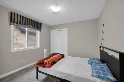77 Saddleland Drive Ne, Calgary, AB - Indoor Photo Showing Bedroom