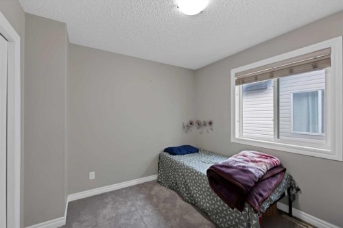 77 Saddleland Drive Ne, Calgary, AB - Indoor Photo Showing Bedroom