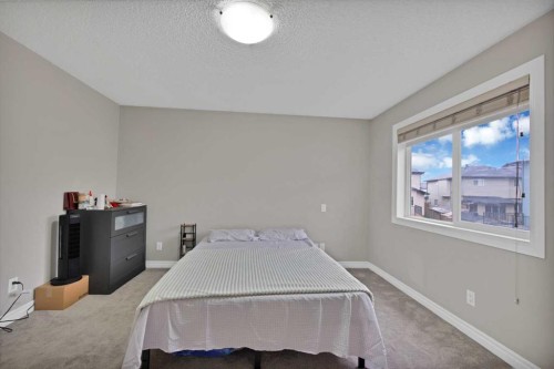 77 Saddleland Drive Ne, Calgary, AB - Indoor Photo Showing Bedroom