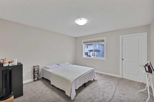 77 Saddleland Drive Ne, Calgary, AB - Indoor Photo Showing Bedroom