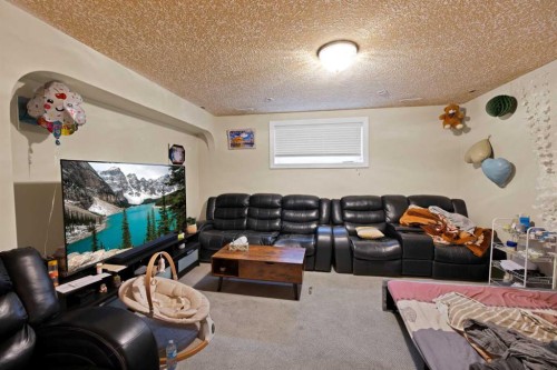 77 Saddleland Drive Ne, Calgary, AB - Indoor Photo Showing Living Room