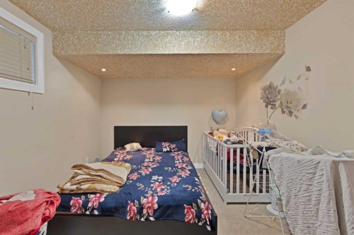 77 Saddleland Drive Ne, Calgary, AB - Indoor Photo Showing Bedroom