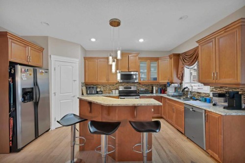 77 Saddleland Drive Ne, Calgary, AB - Indoor Photo Showing Kitchen With Double Sink