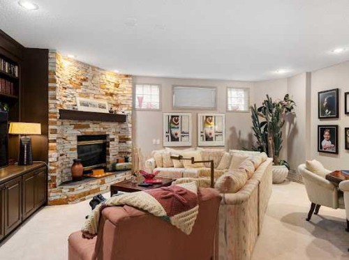 39 Baycrest Court Sw, Calgary, AB - Indoor Photo Showing Living Room With Fireplace