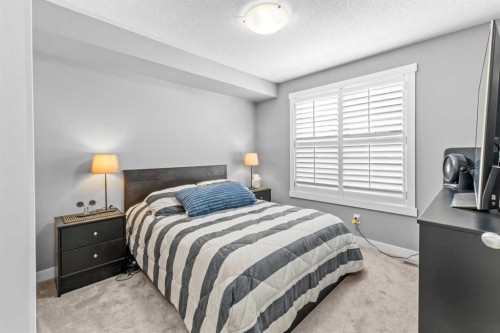 145 Cranford Walk Se, Calgary, AB - Indoor Photo Showing Bedroom