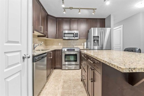 145 Cranford Walk Se, Calgary, AB - Indoor Photo Showing Kitchen With Stainless Steel Kitchen With Upgraded Kitchen