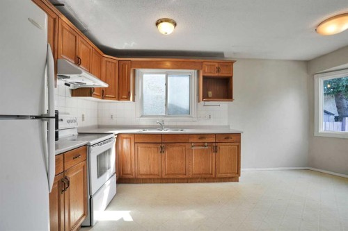 888 Rundlecairn Way Ne, Calgary, AB - Indoor Photo Showing Kitchen With Double Sink