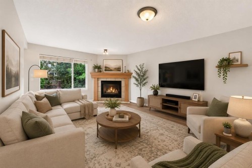 352 Copperfield Gardens Se, Calgary, AB - Indoor Photo Showing Living Room With Fireplace