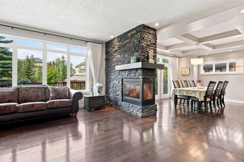 163 Cranarch Circle Se, Calgary, AB - Indoor Photo Showing Living Room With Fireplace