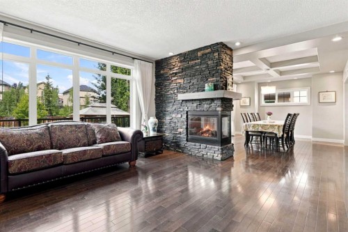 163 Cranarch Circle Se, Calgary, AB - Indoor Photo Showing Living Room With Fireplace