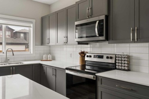 12 Wolf Creek Drive Se, Calgary, AB - Indoor Photo Showing Kitchen With Upgraded Kitchen