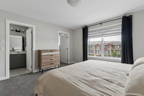 12 Wolf Creek Drive Se, Calgary, AB - Indoor Photo Showing Bedroom