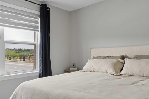 12 Wolf Creek Drive Se, Calgary, AB - Indoor Photo Showing Bedroom