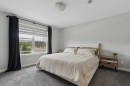 12 Wolf Creek Drive Se, Calgary, AB  - Indoor Photo Showing Bedroom 