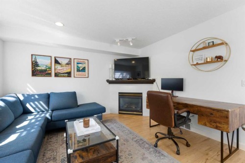 501 55 Avenue Sw, Calgary, AB - Indoor Photo Showing Living Room With Fireplace