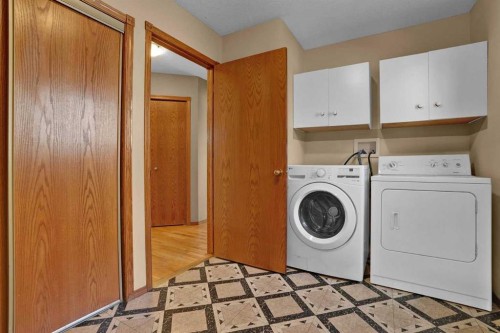 62 West Mitford Crescent, Cochrane, AB - Indoor Photo Showing Laundry Room