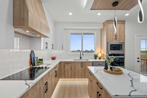 1981 Mccaskill Drive, Crossfield, AB - Indoor Photo Showing Kitchen With Upgraded Kitchen