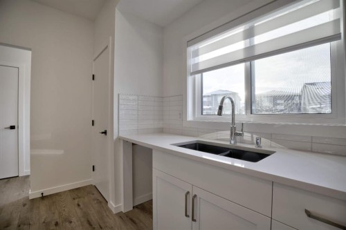 45 Legacy Point Terrace Se, Calgary, AB - Indoor Photo Showing Kitchen With Double Sink